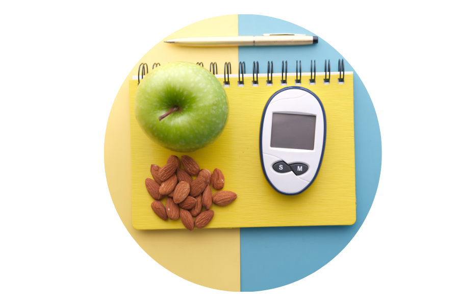 blood-sugar-monitor-healthy-food-type-2-diabetes.png Blood sugar monitor with apple, almonds and notebook, illustrating healthy habits for managing and preventing type 2 diabetes.